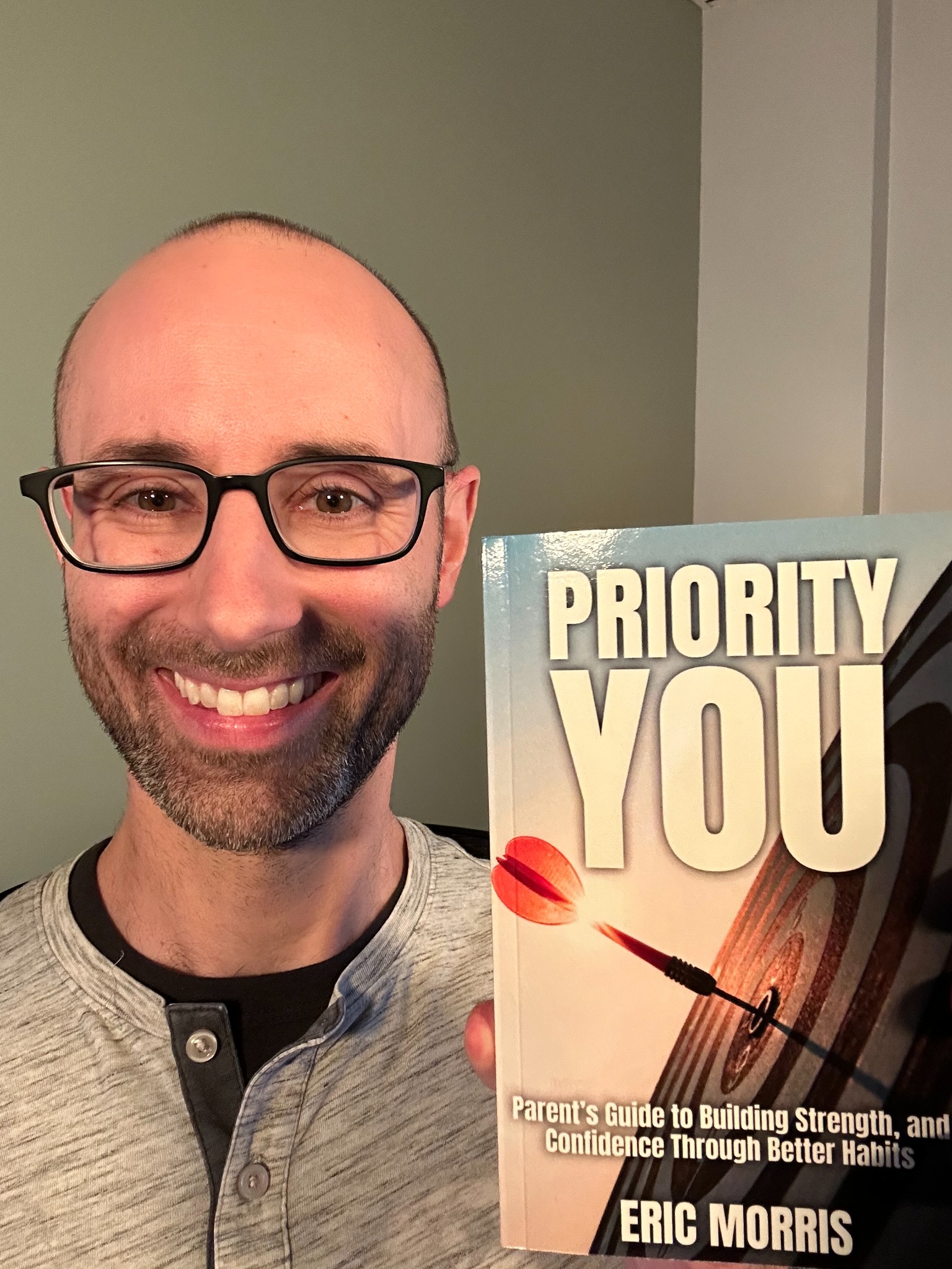 Eric Morris holding Priority YOU